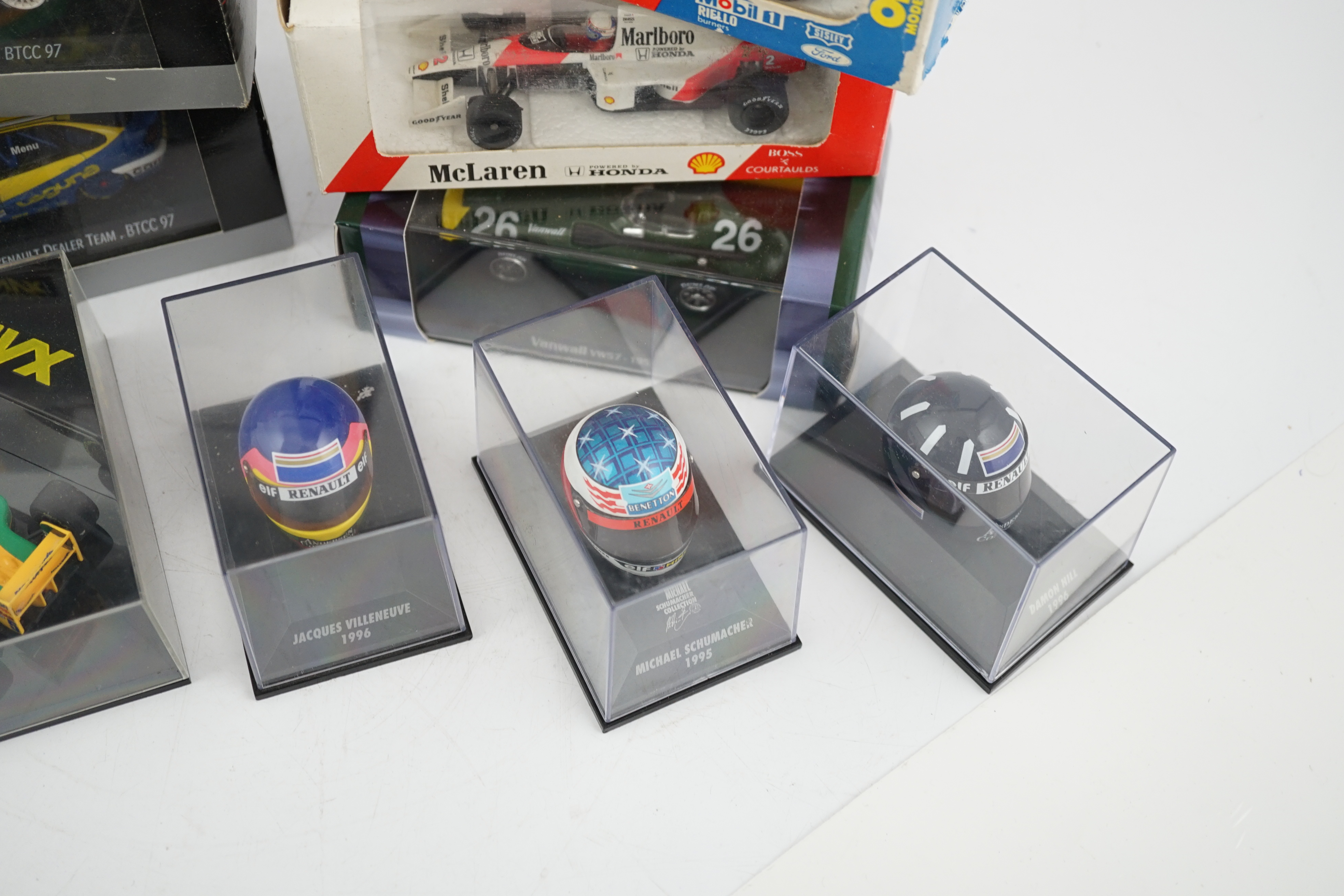 Thirty-seven boxed diecast motor racing related models by Onyx, Atlas Editions, etc. including 1:43 scale Formula One racing cars, models of helmets of famous drivers, etc.